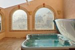 Enjoy the private hot tub in the enclosed atrium